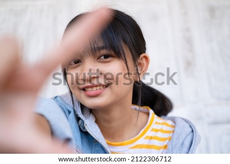 Portrait beautiful young girl wear jean jacket on white door background.