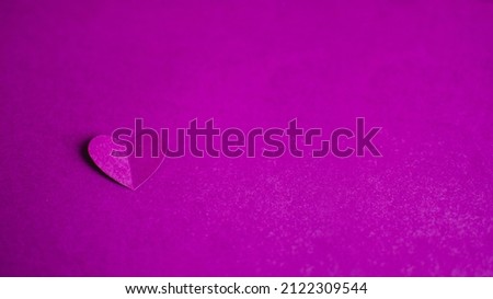 Banner with single purple paper heart on purple background. Happy Valentine Day. Greeting card. DIY Holiday and gift concept. Copy space.