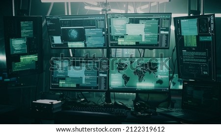 Pan around view of modern computer monitor with world map and various data located on desk in dark room of hacker base Royalty-Free Stock Photo #2122319612