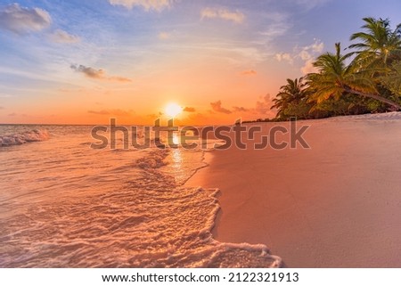 Fantastic closeup view of calm sea water waves with orange sunrise sunset sunlight. Tropical island beach landscape, exotic shore coast. Summer vacation, holiday amazing nature scenic. Relax paradise Royalty-Free Stock Photo #2122321913