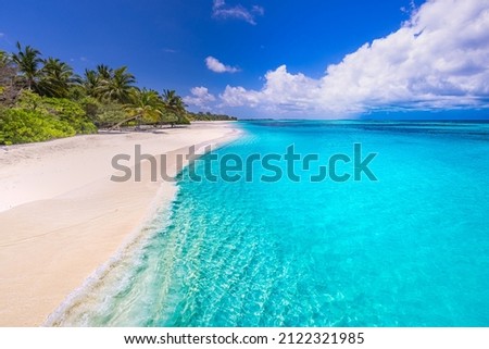 Beautiful, relaxing outdoor landscape of tropical island beach. Palm trees over blue azure ocean lagoon. Exotic traveling destination, summer vacation, beach seaside. Colorful nature sea sand sky view Royalty-Free Stock Photo #2122321985
