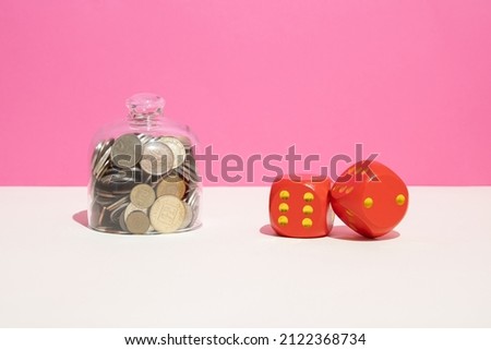 Money. Red dices with vintage coins in a cake holder. Business, dept or risk concept.