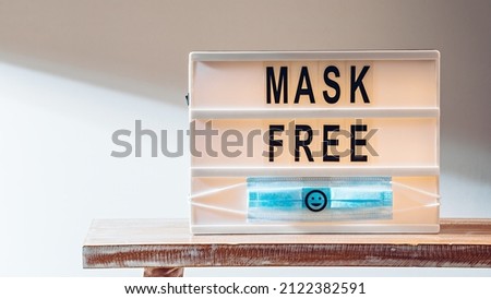 The end of quarantine. The words Mask Free on lightbox
