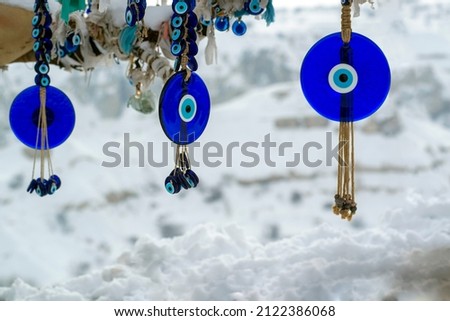 Blue glass evil eye sign on wish tree in Cappadocia from Turkey