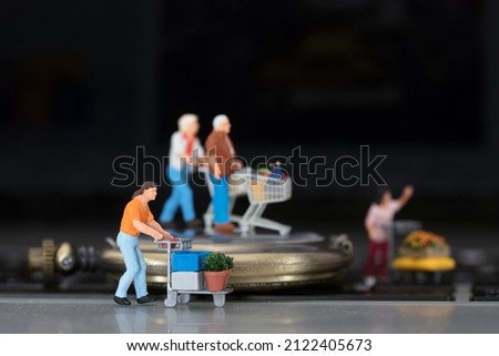 Miniature models of various shopping on computer keyboards and pocket watches