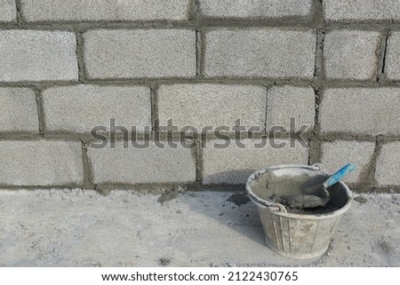 Mixing concrete is the mixing of concrete mixtures such as cement, stone or gravel, sand, water and other admixtures (such as concrete admixtures). Royalty-Free Stock Photo #2122430765