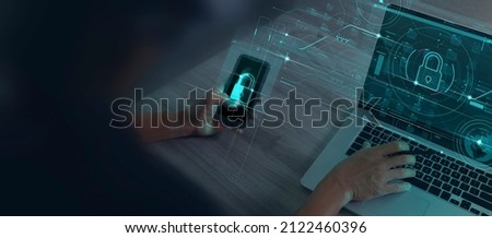 Cyber security and data protection information privacy internet technology concept.Businessman working on smartphone modern computer show padlock protecting business with virtual network connection. Royalty-Free Stock Photo #2122460396