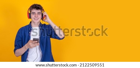 teenager with headphones and mobile phone isolated
