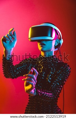 Modern beauty portrait. Young woman with shaved head and virtual reality visor glasses Royalty-Free Stock Photo #2122513919