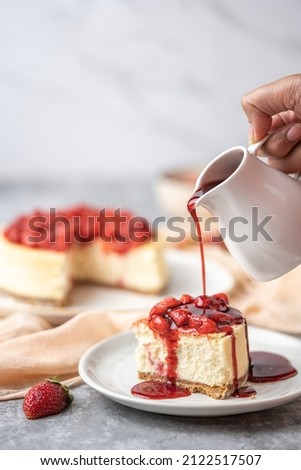 Strawberry and Custard Cheesecake with Strawberry Syrup Royalty-Free Stock Photo #2122517507