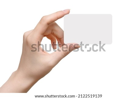 Female hand holding and shows blank card isolated on a white background