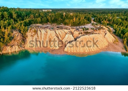 Quarry and golden beach with beautiful blue, turquoise water. Aerial photography from, a drone. Ukraine. concept, vacation, travel, nature and landscape