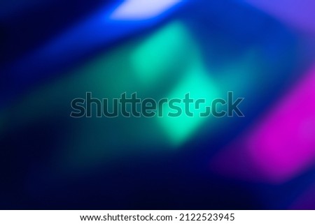 Neon blur glow. Color light overlay. Disco illumination. Defocused blue pink green ultraviolet radiance soft texture on dark abstract empty space background. Royalty-Free Stock Photo #2122523945