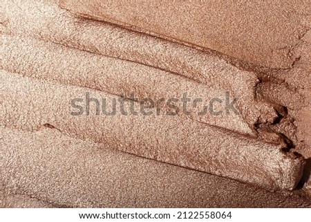 Macro photography of the cosmetic highlighter with shimmer. Royalty-Free Stock Photo #2122558064