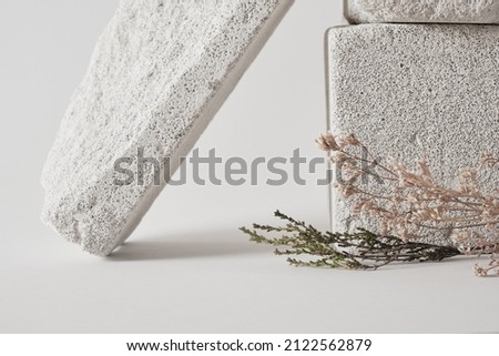 concrete podiums and dry grass, mock-up background for your product presentation concept, copy space template, minimalist product show background