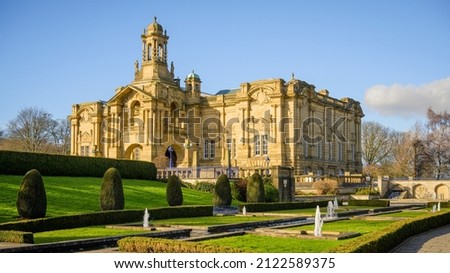 Cartwright Hall in Lister park, Bradford, Yorkshire viewed from the Mughal water gardens. Royalty-Free Stock Photo #2122589375