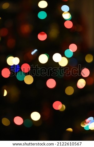 Abstract blurred glittering shinny lights on dark background
