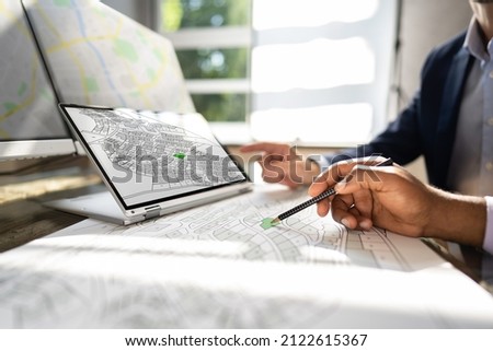 Cadastre Map And City Building Survey On Laptop Royalty-Free Stock Photo #2122615367