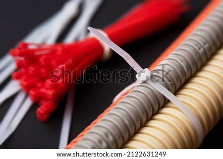wire cutters with electric cable, plastic ties, and a colored outer shell for electrical wiring Royalty-Free Stock Photo #2122631249