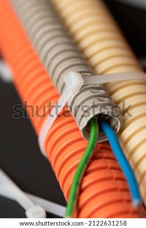 wire cutters with electric cable, plastic ties, and a colored outer shell for electrical wiring Royalty-Free Stock Photo #2122631258
