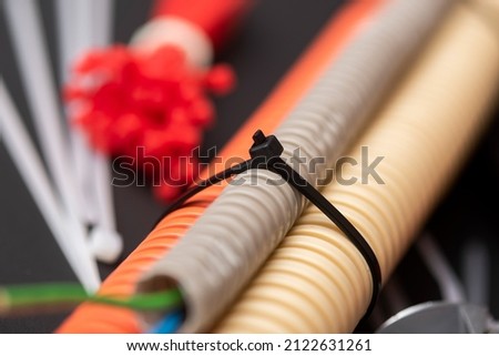 wire cutters with electric cable, plastic ties, and a colored outer shell for electrical wiring Royalty-Free Stock Photo #2122631261