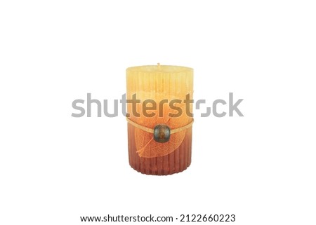 Yellow candle isolated on white background