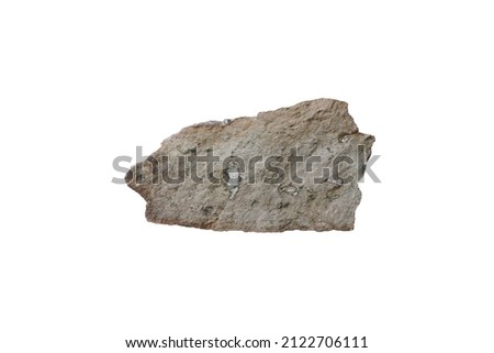 Cut out a speciment of tuff igneous rock isolated on white background. Tuff is an igneous rock that forms from the products of an explosive volcanic eruption. Royalty-Free Stock Photo #2122706111