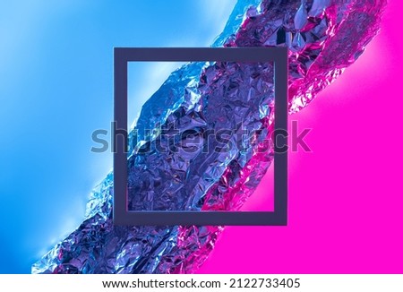 Aluminium foil surface with dark square frame. Futuristic abstract background.