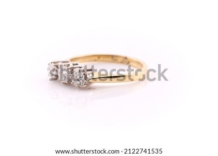 A diamond cluster ring set in gold. Isolated on a white background.