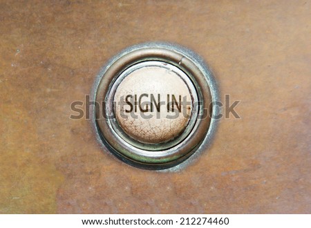Grunge image of an old button - sign in