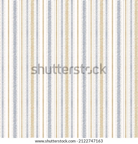 Seamless French country kitchen stripe fabric pattern print. Blue yellow white vertical striped background. Batik dye provence style rustic woven cottagecore textile.  Royalty-Free Stock Photo #2122747163