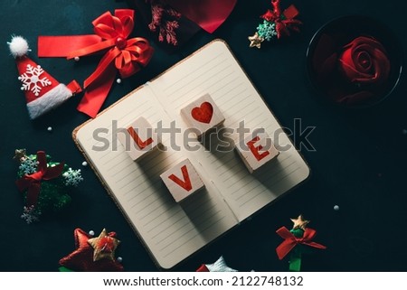 Valentine's Day idea, wooden block with text and red rose as background.
and flowers, christmas valentines day concept

