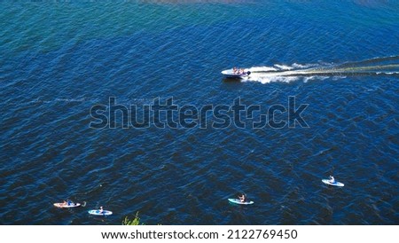 landscape, view of the river, Volga, boats go on the river and people do water sports 