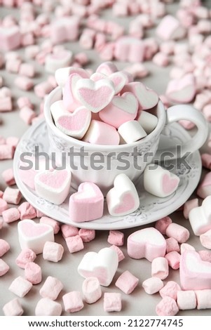 Cup of  hearts shaped marshmallow. Valentine's  or wedding day concept. Romantic girly femininy background