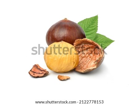 Close-up Chestnuts with peeled with green leaves isolated on white background. Royalty-Free Stock Photo #2122778153