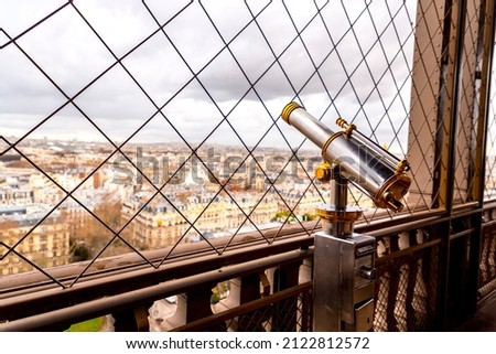 Paris, France - JAN 20, 2022: Detail from the iconic Eiffel Tower, wrought-iron lattice tower designed by Gustave Eiffel on the Champ de Mars in Paris, France.