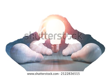 Double exposure between businessman  hold the head with two hand and glowing lightbulb for creative thinking and serious business concept.