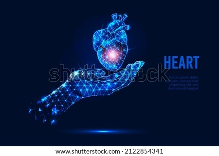 Futuristic modern vector illustration with a glowing hand holding a human heart. Royalty-Free Stock Photo #2122854341