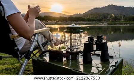 Asian woman travel and camping alone at natural park in Thailand. Recreation and journey outdoor activity lifestyle. Royalty-Free Stock Photo #2122867550