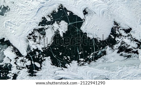 View of the frozen water from above with textures and patters