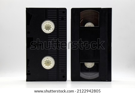Vintage VHS video tape cassette on white background. Retro style technology from the 90s