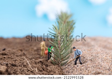 Planting trees on Arbor Day to prevent desertification of cultivated land Royalty-Free Stock Photo #2122991528