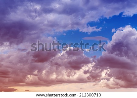Clouds with blue sky background. Color toned image. 