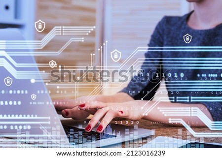 Businesswoman wearing formal wear works on laptop typing message. Digital interface with line connection, padlocks, binary code in the foreground. Office workplace. Concept of technologies in business