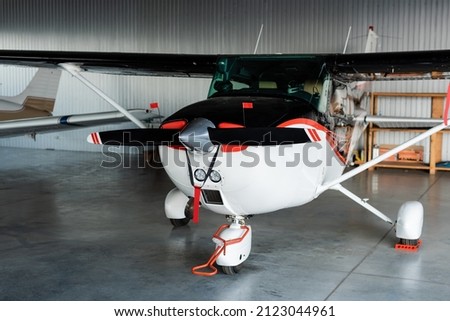 modern helicopter with propeller and airfoils on parking Royalty-Free Stock Photo #2123044961