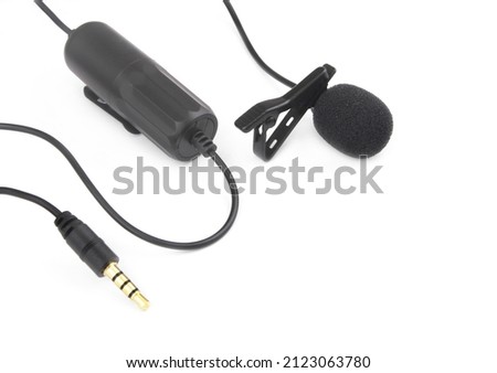 Lavalier microphone with cord isolated on white background, room for text.