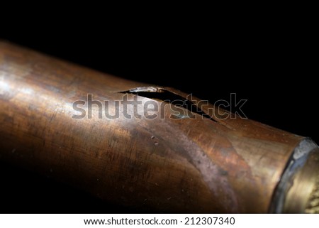 A pipe with frost and freeze damage Royalty-Free Stock Photo #212307340