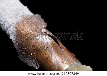 A pipe showing freeze damage Royalty-Free Stock Photo #212307349