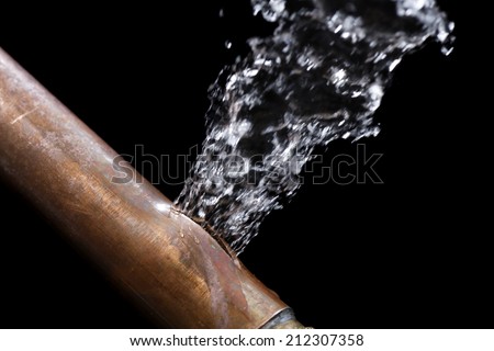 A pipe leaking due to freezing Royalty-Free Stock Photo #212307358