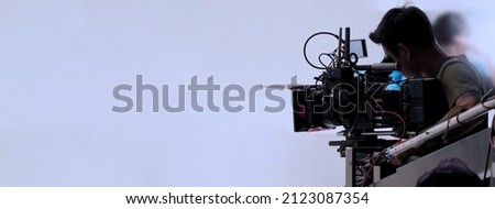 Recording video at studio. Camera records or filming for professional bloggers. Behind the scenes of filming video production. film crew on the set in film studio. Backstage video production recording Royalty-Free Stock Photo #2123087354